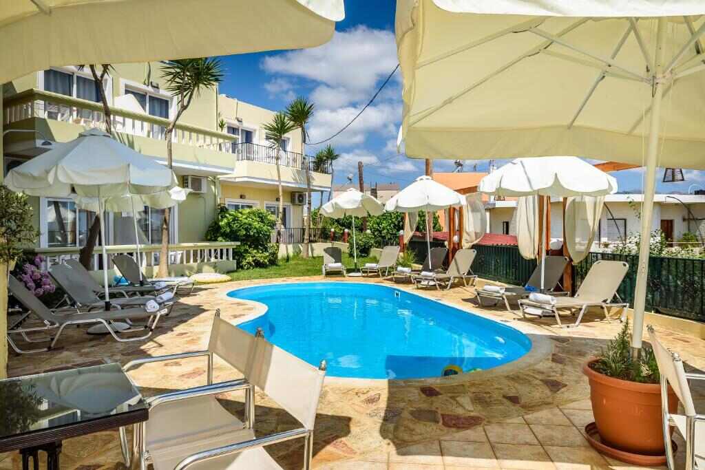 Pool terrace with umbrellas at Irinoula Dreams
